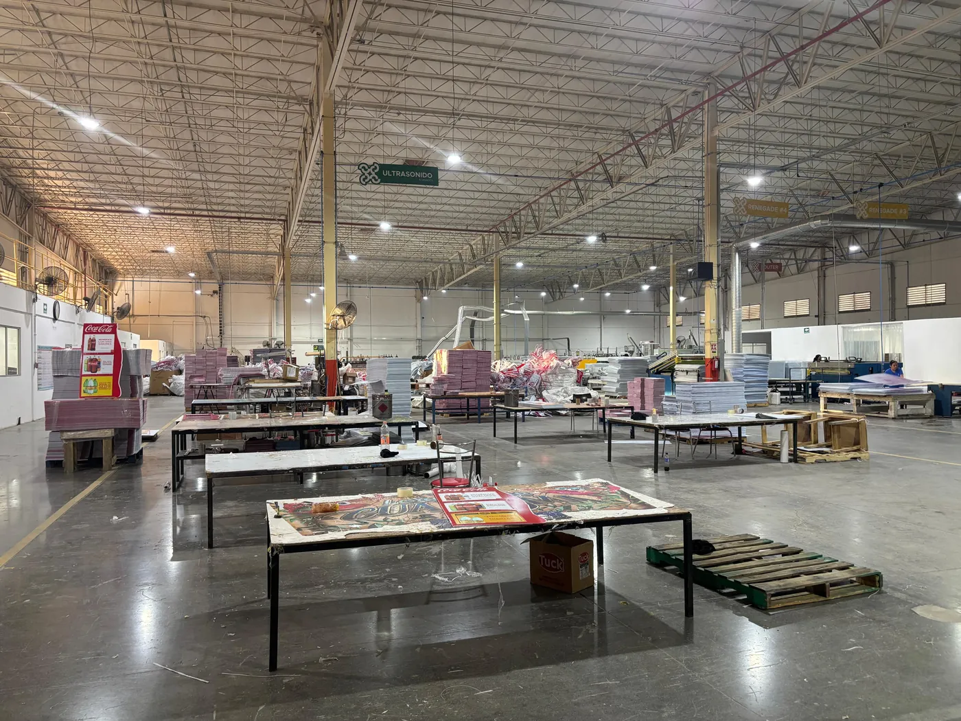Cassium production floor with work tables and finished corrugated sheet